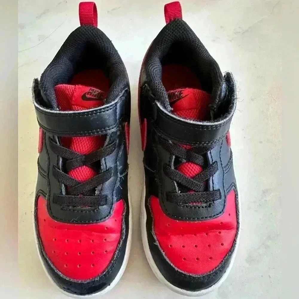 Black and red Nike Kids shoes